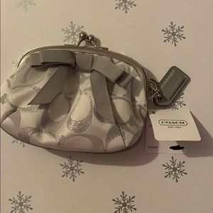 Silver/white Coach coin purse with bow